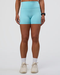 Woman wearing Fusion Ultra High-Rise 4" Short Pockets - Baltic Sea | Set:true | Angle:front | Model:Sav | Size:S