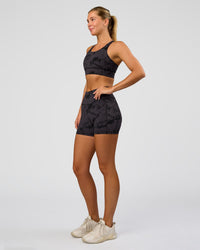Woman wearing Fusion Ultra High-Rise 4" Short Pockets - Black Tie Dye | Model:Amity | Size:S | Thumbnail Index: 4