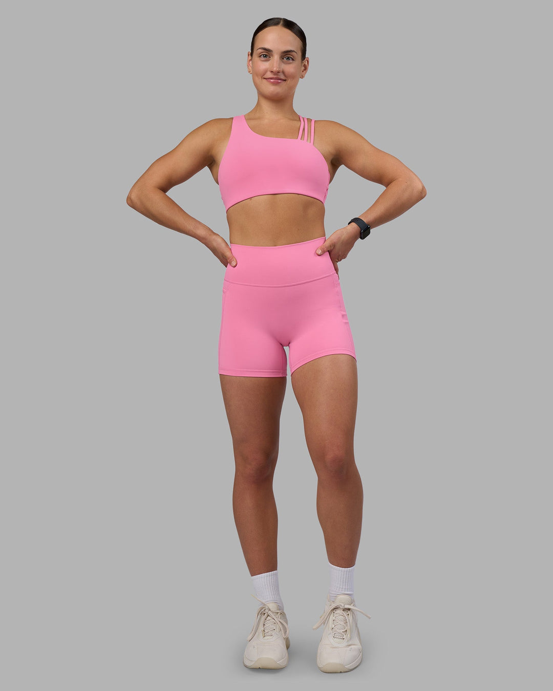 Woman wearing Fusion Ultra High-Rise 4" Short Pockets - Candy Pink | Model:Keisha | Size:S