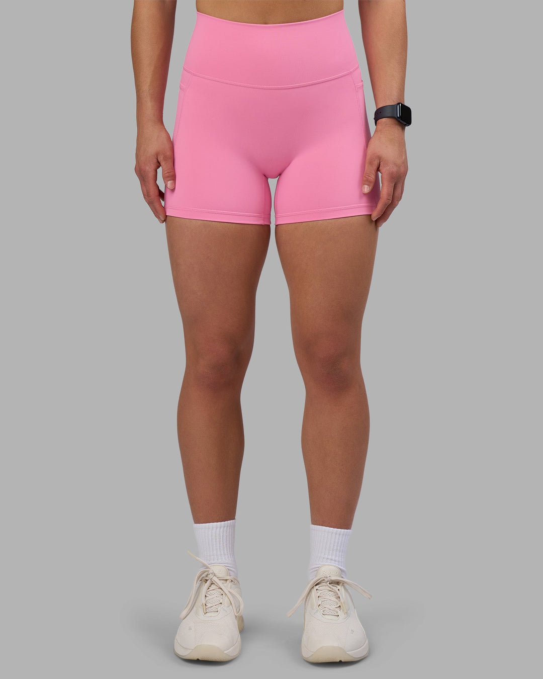Woman wearing Fusion Ultra High-Rise 4" Short Pockets - Candy Pink | Model:Keisha | Size:S