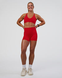 Woman wearing Fusion Ultra High-Rise 4" Short Pockets - Flame | Model:Sav | Size:S