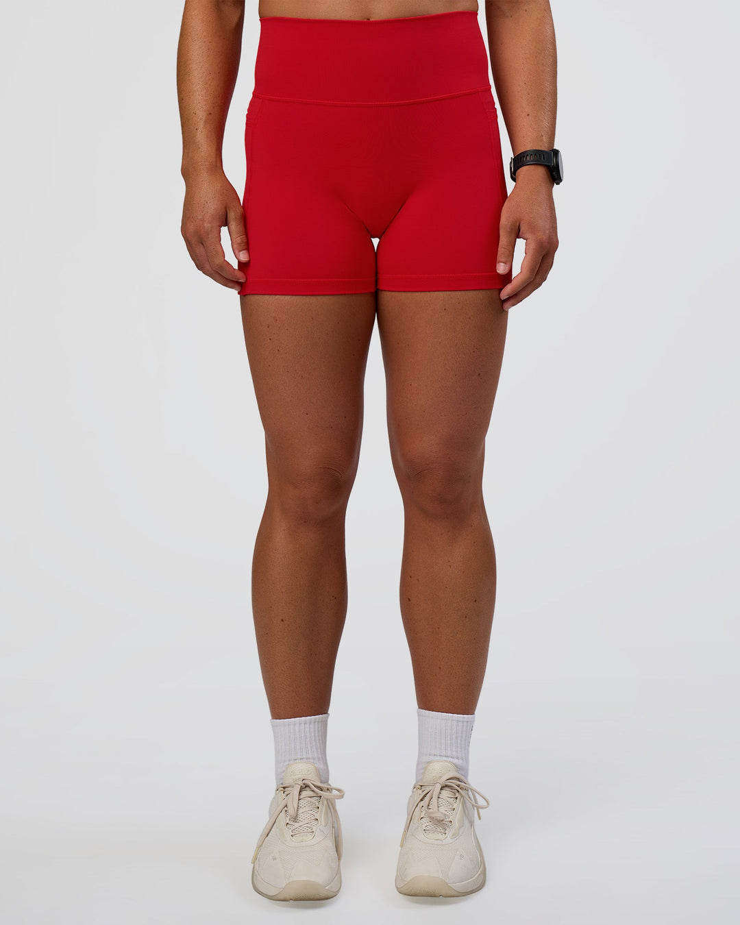 Woman wearing Fusion Ultra High-Rise 4" Short Pockets - Flame | Set:true | Angle:front | Model:Sav | Size:S