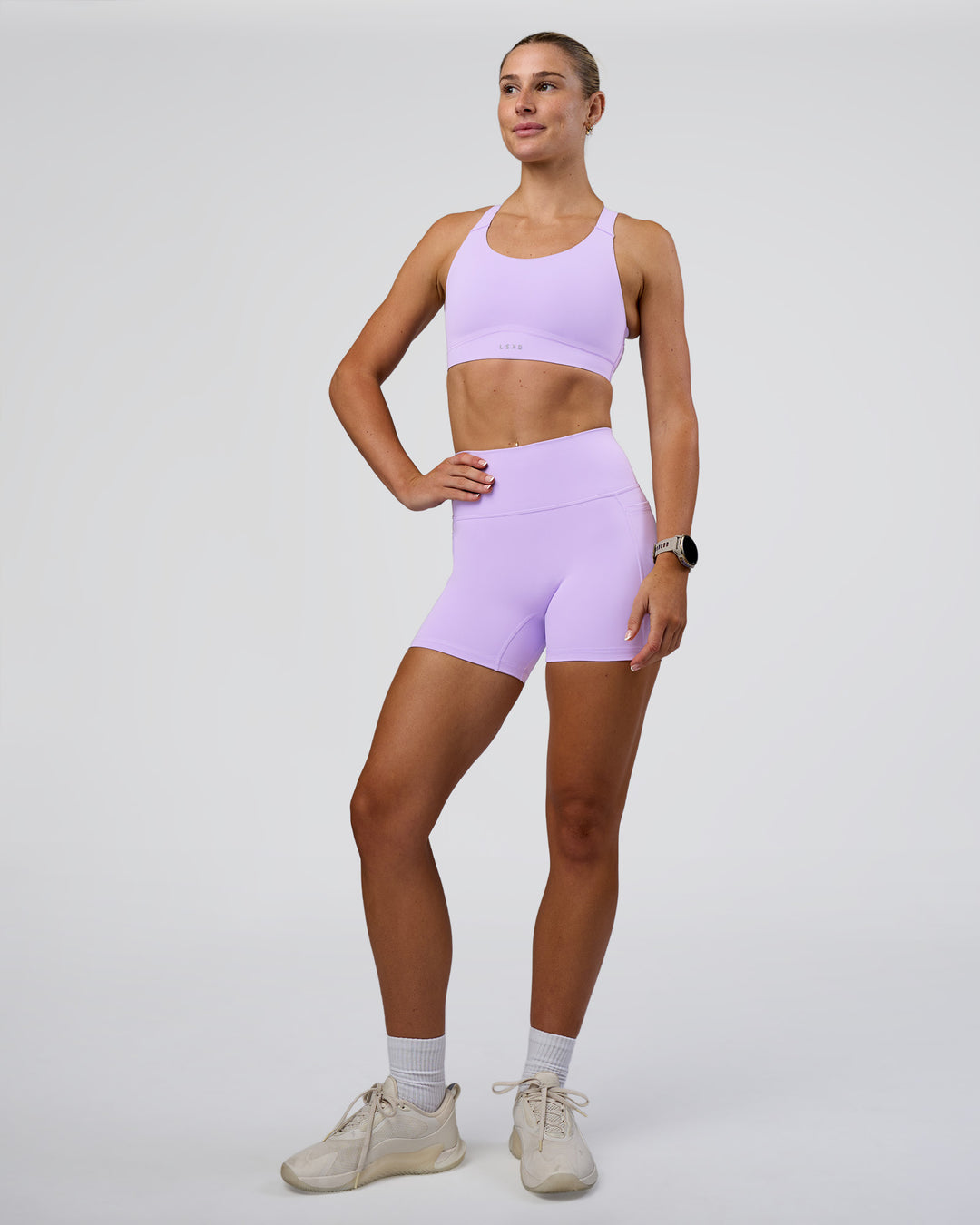 Woman wearing Fusion Ultra High-Rise 4&quot; Short Pockets - Pale Lilac | Model:Emelia | Size:S