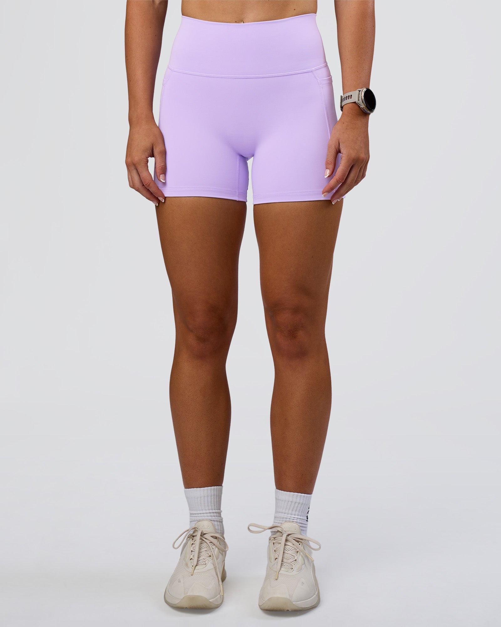 Woman wearing Fusion Ultra High-Rise 4" Short Pockets - Pale Lilac | Model:Emelia | Size:S
