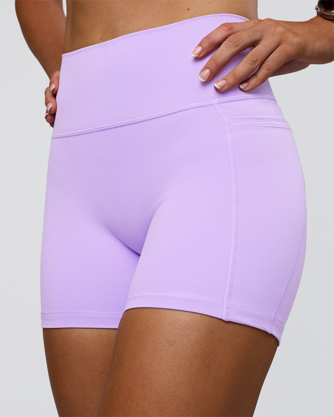 Woman wearing Fusion Ultra High-Rise 4&quot; Short Pockets - Pale Lilac | Model:Emelia | Size:S