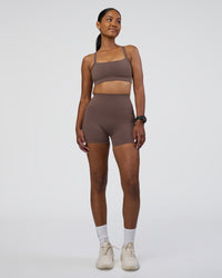 Woman wearing Fusion Ultra High-Rise 4" Short Pockets - Peppercorn | Model:Rica | Size:S