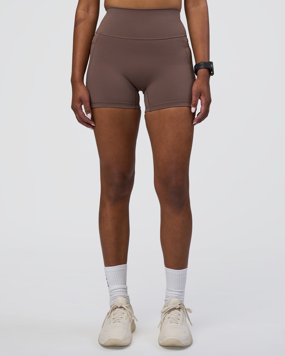 Woman wearing Fusion Ultra High-Rise 4" Short Pockets - Peppercorn | Set:true | Angle:front | Model:Rica | Size:S