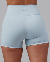 Woman wearing Fusion Ultra High-Rise 4" Short Pockets - Skyride | Model:Rhiley | Size:S