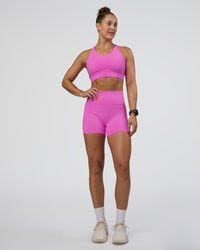 Woman wearing Fusion Ultra High-Rise 4" Short Pockets - Ultra Fuchsia | Model:Abbey | Size:S