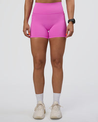 Woman wearing Fusion Ultra High-Rise 4" Short Pockets - Ultra Fuchsia | Set:true | Angle:front | Model:Abbey | Size:S