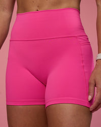 Woman wearing Fusion Ultra High-Rise 4" Short Pockets - Ultra Pink | Model:Hannah | Size:S