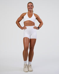 Woman wearing Fusion Ultra High-Rise 4" Short Pockets - White | Model:Sav | Size:S