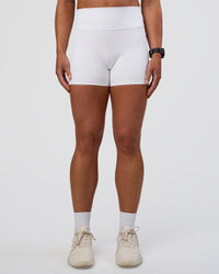 Woman wearing Fusion Ultra High-Rise 4" Short Pockets - White | Model:Sav | Size:S