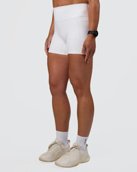 Woman wearing Fusion Ultra High-Rise 4" Short Pockets - White | Model:Sav | Size:S