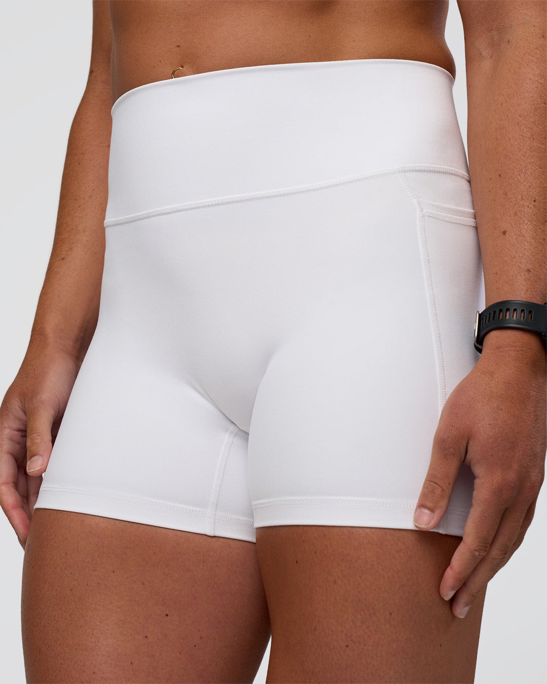 Woman wearing Fusion Ultra High-Rise 4" Short Pockets - White | Model:Sav | Size:S