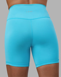 Woman wearing Fusion Ultra High-Rise 6" Short - Blue Atoll | Model:Katie | Size:S