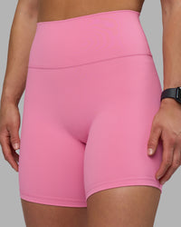 Woman wearing Fusion Ultra High-Rise 6" Short - Candy Pink | Set:true | Angle:closeup | Model:Keisha | Size:S