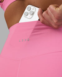 Woman wearing Fusion Ultra High-Rise 6" Short - Candy Pink | Model:Keisha | Size:S