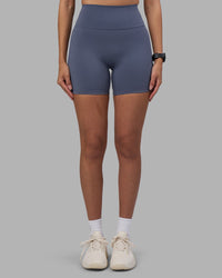 Woman wearing Fusion Ultra High-Rise 6" Short - Night Shadow | Set:true | Angle:front | Model:Rhiley | Size:S