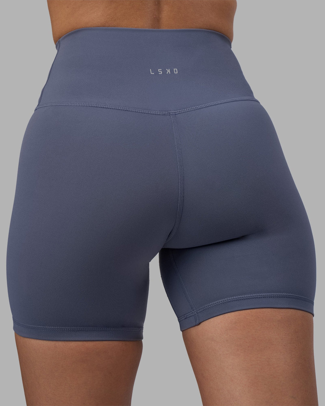 Woman wearing Fusion Ultra High-Rise 6&quot; Short - Night Shadow | Model:Rhiley | Size:S