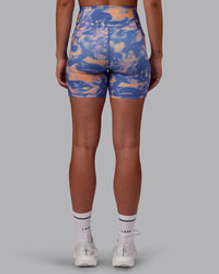 Woman wearing Fusion Ultra High-Rise 6" Short Pockets - Apricot Mist | Set:true | Angle:back | Model:Charlize | Size:S
