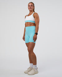 Woman wearing Fusion Ultra High-Rise 6" Short Pockets - Baltic Sea | Model:Sav | Size:S