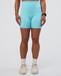 Woman wearing Fusion Ultra High-Rise 6" Short Pockets - Baltic Sea | Set:true | Angle:front | Model:Sav | Size:S