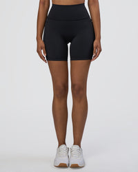Woman wearing Fusion Ultra High-Rise 6" Short Pockets - Black | Model:Jordan | Size:S