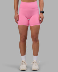 Woman wearing Fusion Ultra High-Rise 6" Short Pockets - Candy Pink | Set:true | Angle:front | Model:Keisha | Size:S