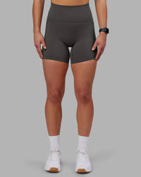 Woman wearing Fusion Ultra High-Rise 6" Short Pockets - Dark Storm | Set:true | Angle:front | Model:Keisha | Size:S