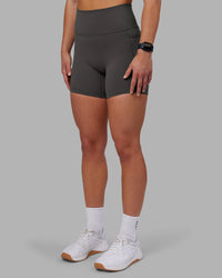 Woman wearing Fusion Ultra High-Rise 6" Short Pockets - Dark Storm | Set:true | Angle:side | Model:Keisha | Size:S