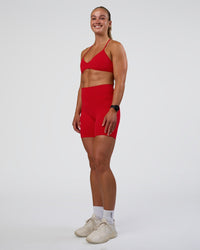 Woman wearing Fusion Ultra High-Rise 6" Short Pockets - Flame | Model:Sav | Size:S