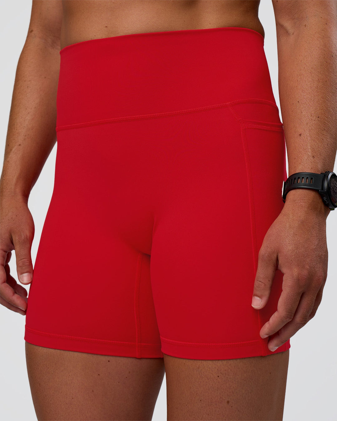 Woman wearing Fusion Ultra High-Rise 6" Short Pockets - Flame | Model:Sav | Size:S