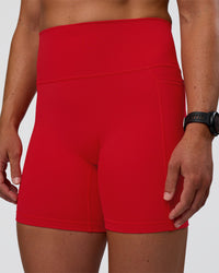 Woman wearing Fusion Ultra High-Rise 6" Short Pockets - Flame | Model:Sav | Size:S