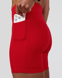 Woman wearing Fusion Ultra High-Rise 6" Short Pockets - Flame | Model:Sav | Size:S