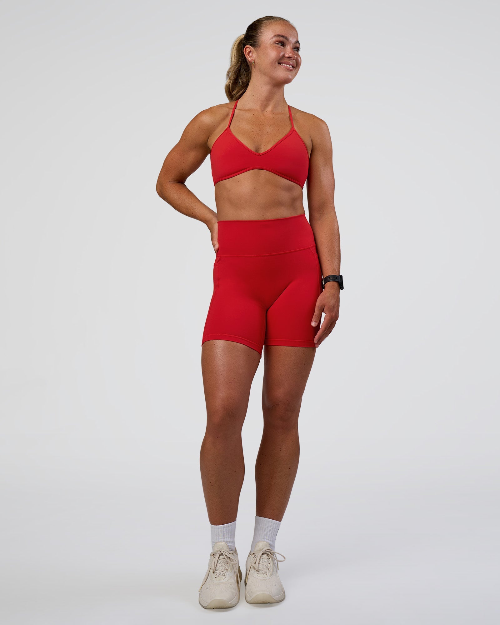 Woman wearing Fusion Ultra High-Rise 6" Short Pockets - Flame | Model:Sav | Size:S