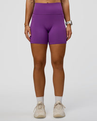 Woman wearing Fusion Ultra High-Rise 6" Short Pockets - Fresh Purple | Set:true | Angle:front | Model:Summer | Size:S