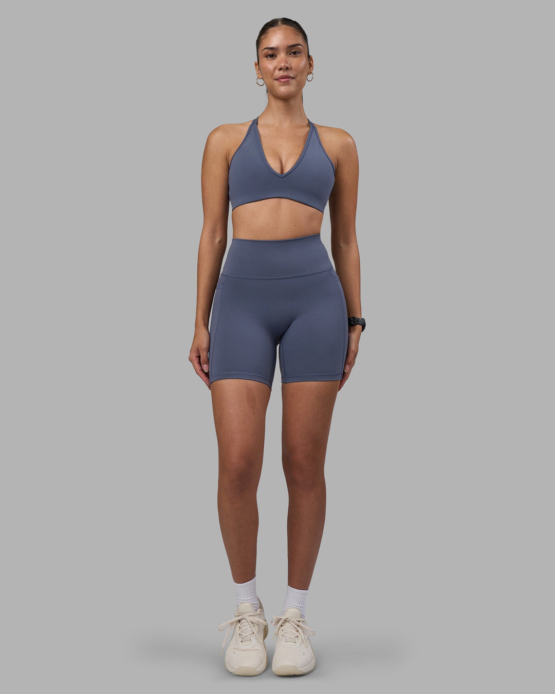 Woman wearing Fusion Ultra High-Rise 6&quot; Short Pockets - Night Shadow | Model:Rhiley | Size:S