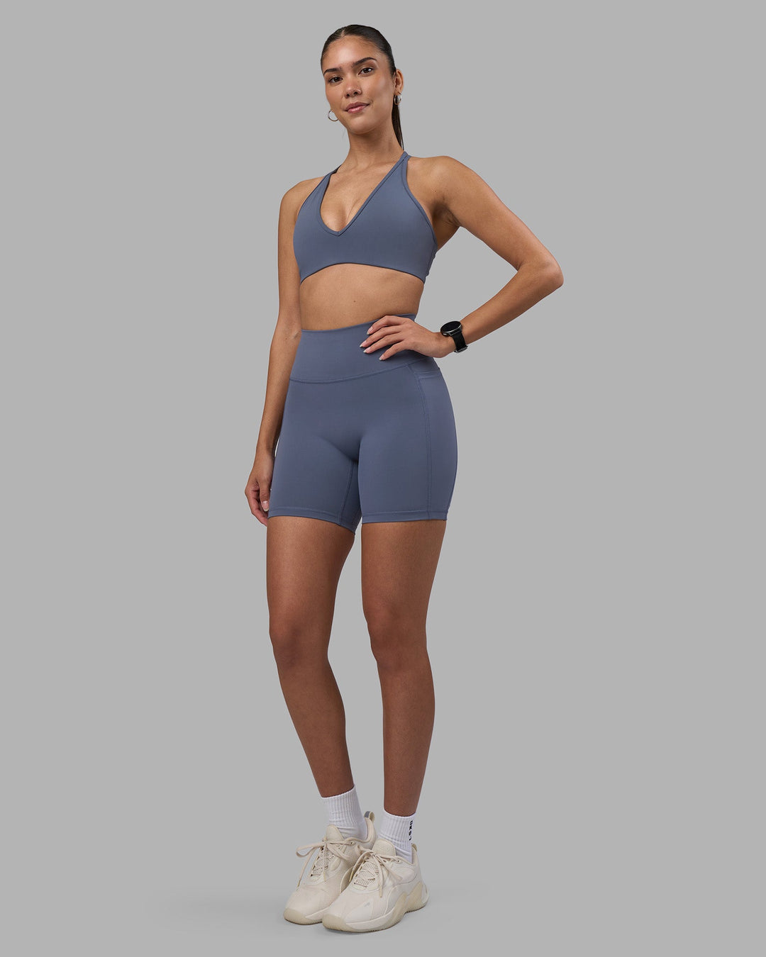 Woman wearing Fusion Ultra High-Rise 6&quot; Short Pockets - Night Shadow | Model:Rhiley | Size:S