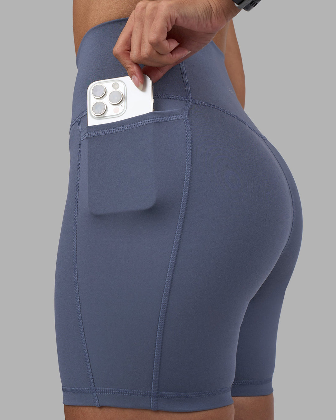 Woman wearing Fusion Ultra High-Rise 6&quot; Short Pockets - Night Shadow | Model:Rhiley | Size:S