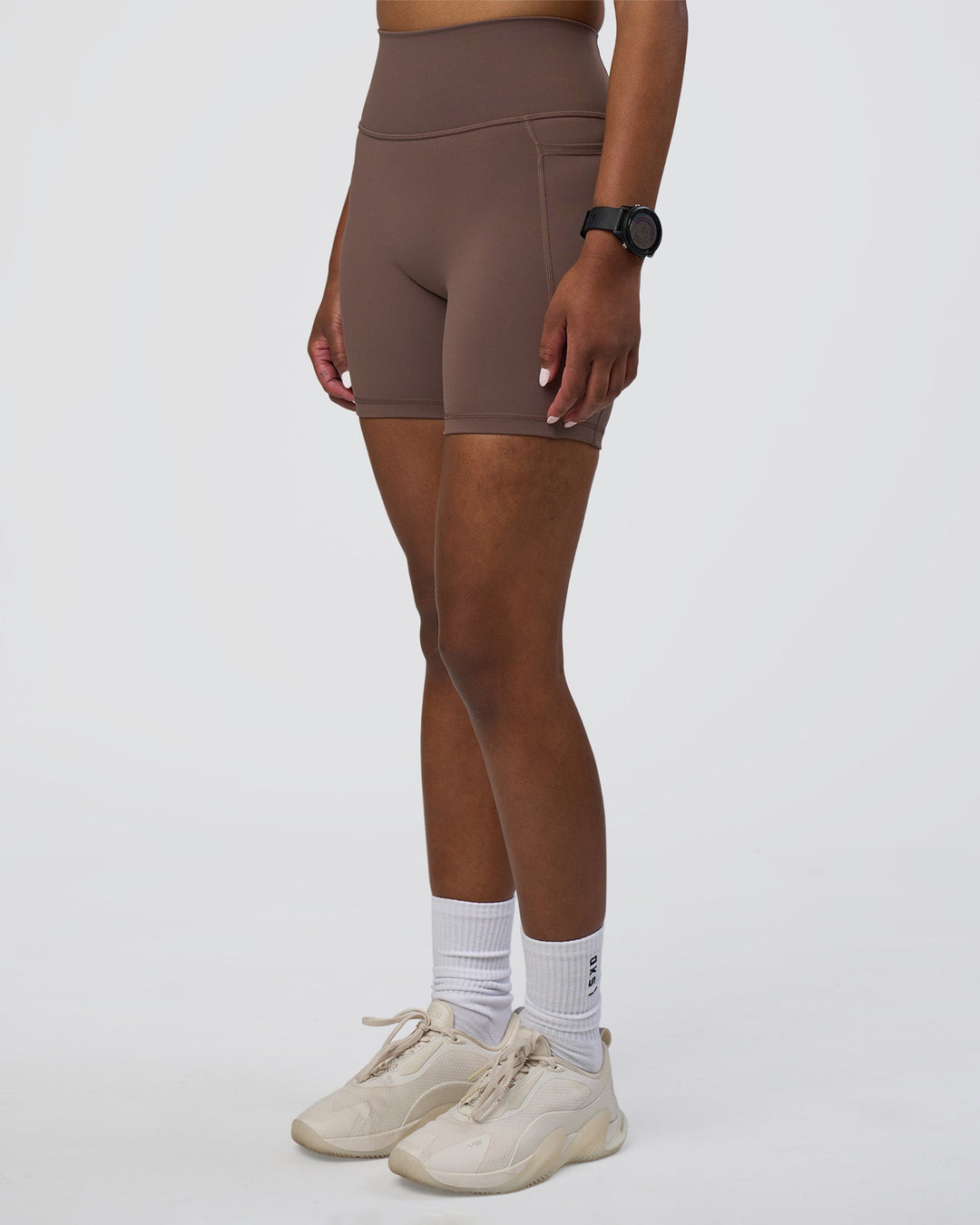 Woman wearing Fusion Ultra High-Rise 6&quot; Short Pockets - Peppercorn | Model:Rica | Size:S