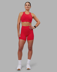 Woman wearing Fusion Ultra High-Rise 6" Short Pockets - Scarlet | Model:Keisha | Size:S