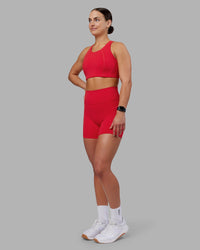 Woman wearing Fusion Ultra High-Rise 6" Short Pockets - Scarlet | Model:Keisha | Size:S