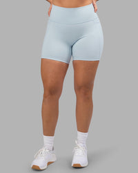 Woman wearing Fusion Ultra High-Rise 6" Short Pockets - Skyride| Set:true | Angle:front | Model:Robyn | Size:S