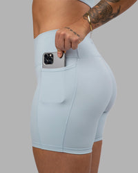 Woman wearing Fusion Ultra High-Rise 6" Short Pockets - Skyride| Set:true | Angle:closeup | Model:Robyn | Size:S