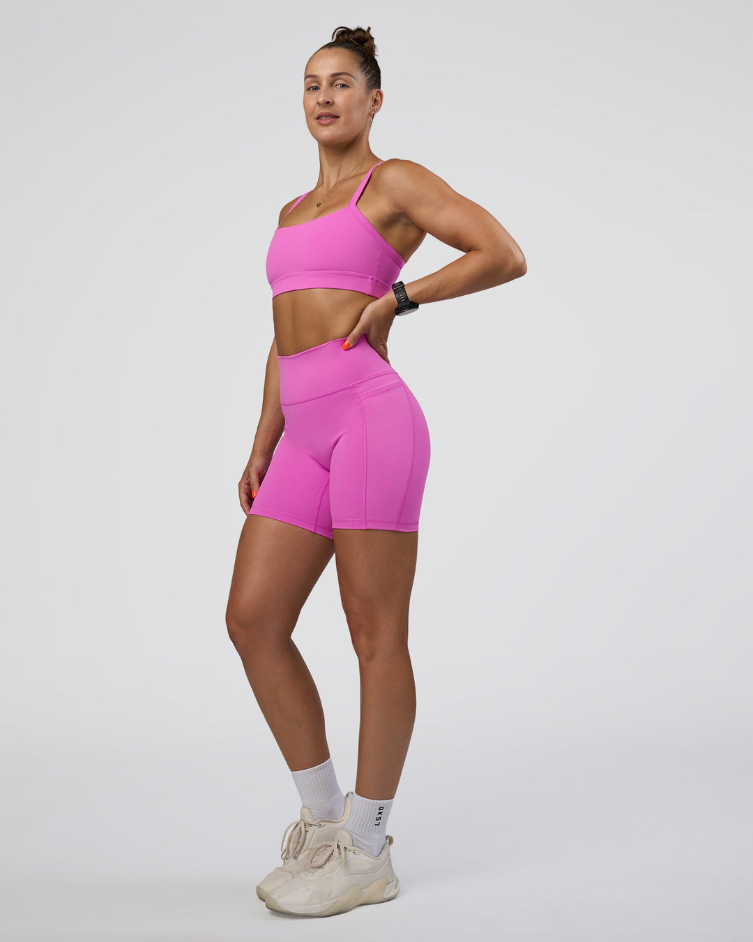 Woman wearing Fusion Ultra High-Rise 6&quot; Short Pockets - Ultra Fuchsia | Model:Abbey | Size:S