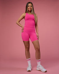 Woman wearing Fusion Ultra High-Rise 6" Short Pockets - Ultra Pink | Model:Tianah | Size:S