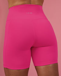 Woman wearing Fusion Ultra High-Rise 6" Short Pockets - Ultra Pink | Model:Hannah | Size:S