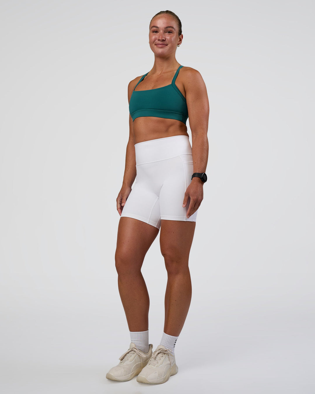 Woman wearing Fusion Ultra High-Rise 6" Short Pockets - White | Model:Sav | Size:S
