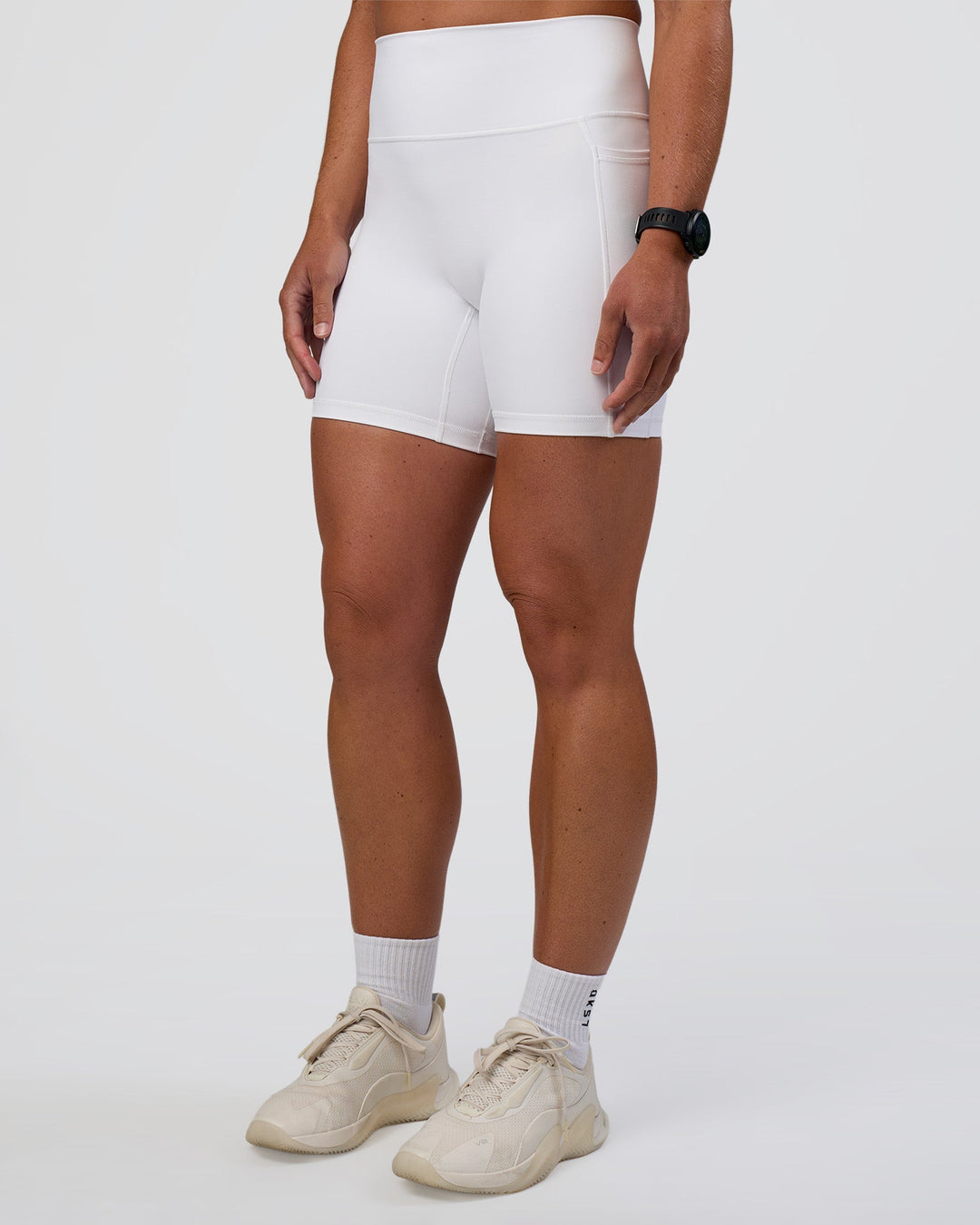 Woman wearing Fusion Ultra High-Rise 6" Short Pockets - White | Model:Sav | Size:S